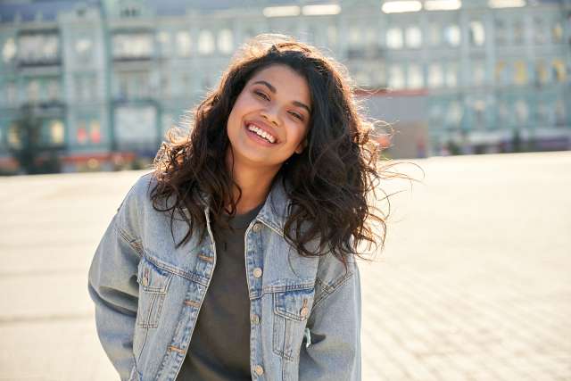 A teen girl smiles. This is related to concepts of teen therapy in St. Louis, MO. Our teen therapist in St. Louis, MO are happy to help through teen therapy in St. Louis, MO.
